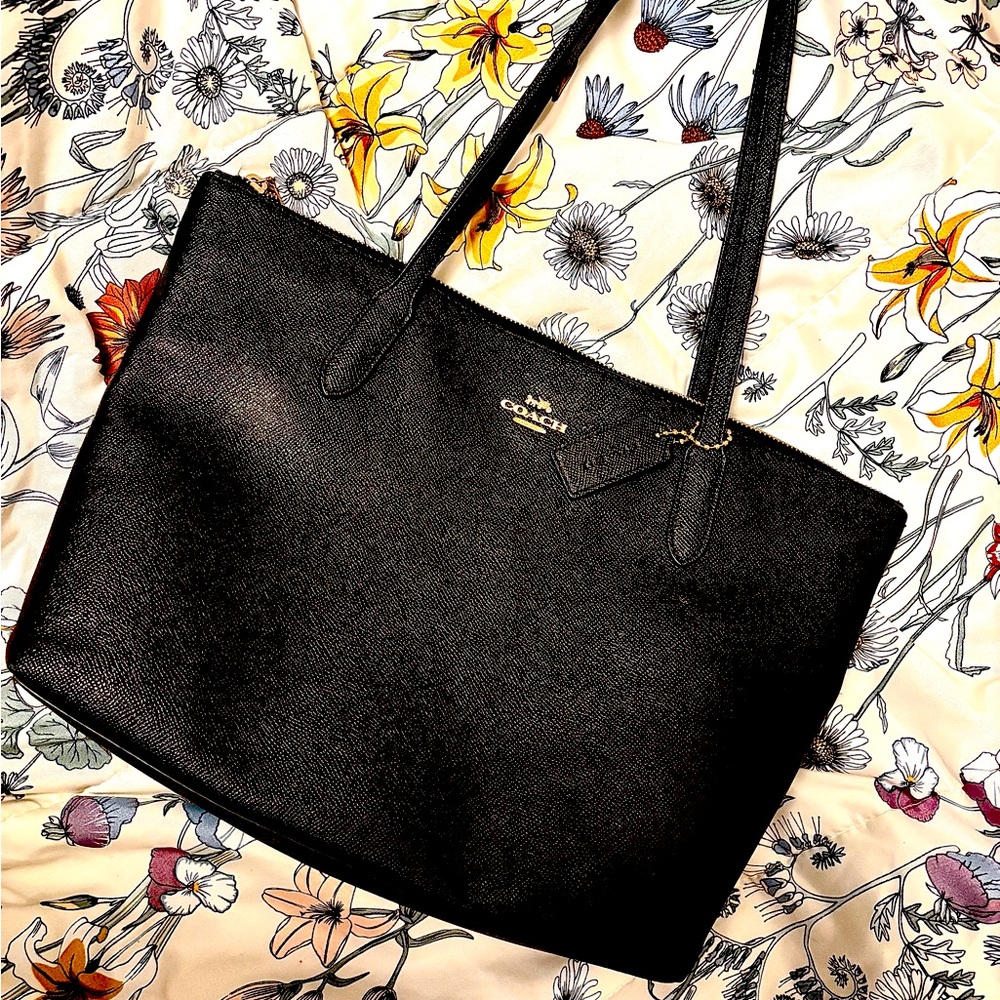 Coach black leather tote. Black lining inside gold hardware and coach tag.